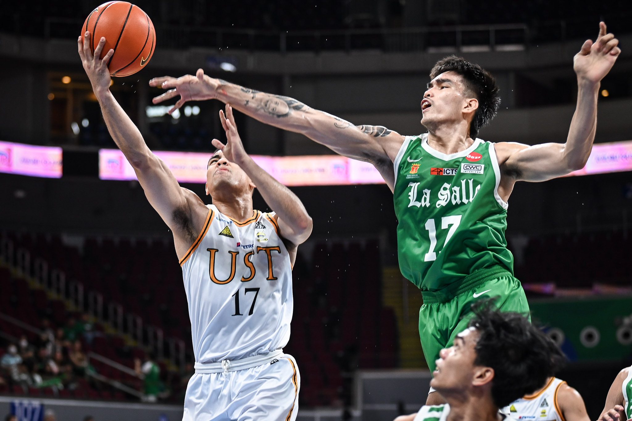 UST-Dominates-Defending-Champion-UP-with-Akowe's-Stellar-Double-Double-in-UAAP-Season-88-Opener